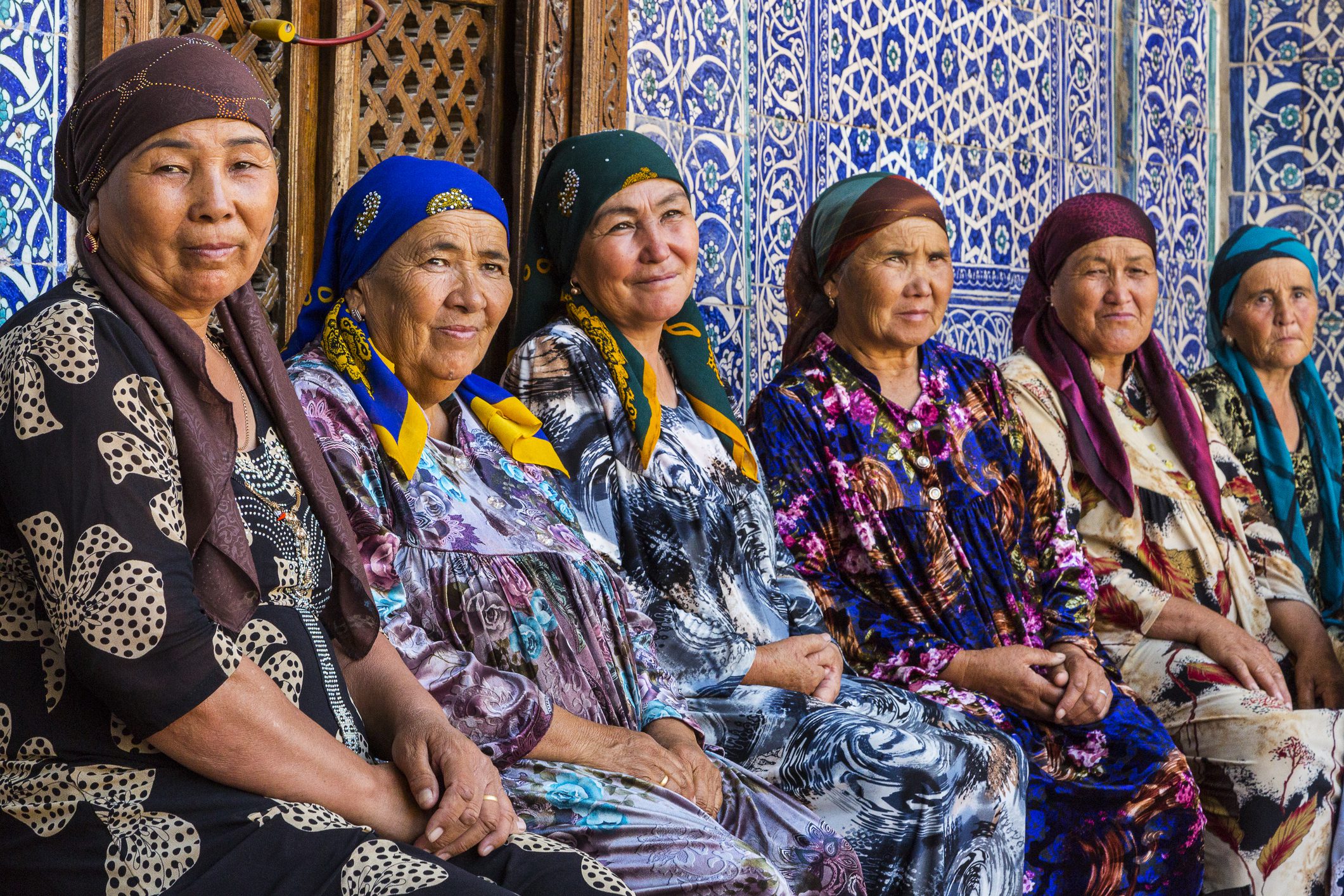 Uzbek women in colorful dresses.