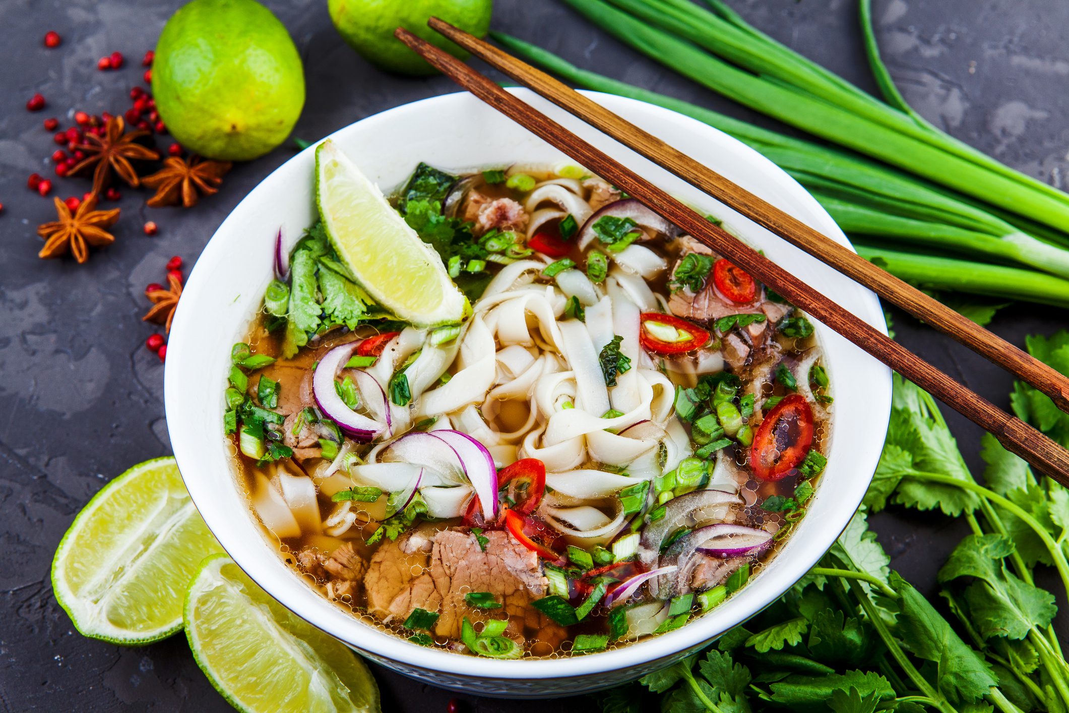 Vietnamese Beef Noodle Soup Pho Bo with beef on dark background